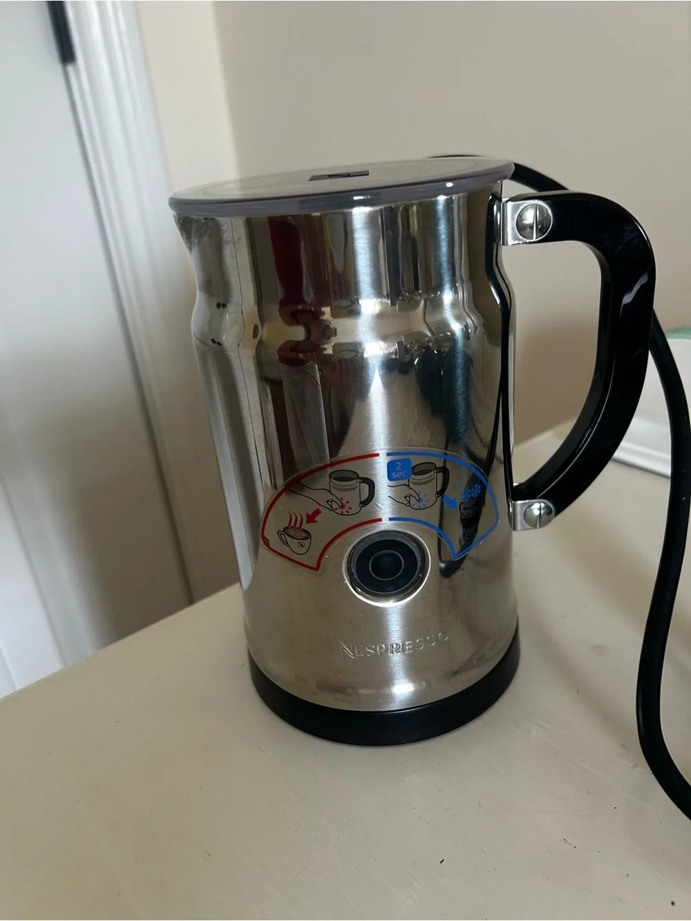 Nespresso Stainless Steel Milk Frother with Black Handle and Red/Blue Icons
